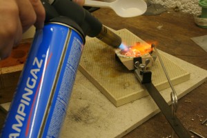 adding powdered borax to the melting silver