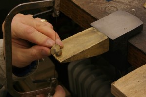 cutting off the sprue from the cast silver