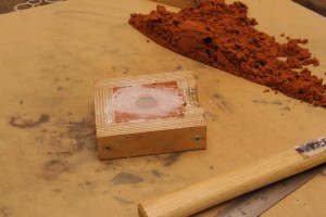 push the carved item into the delft clay